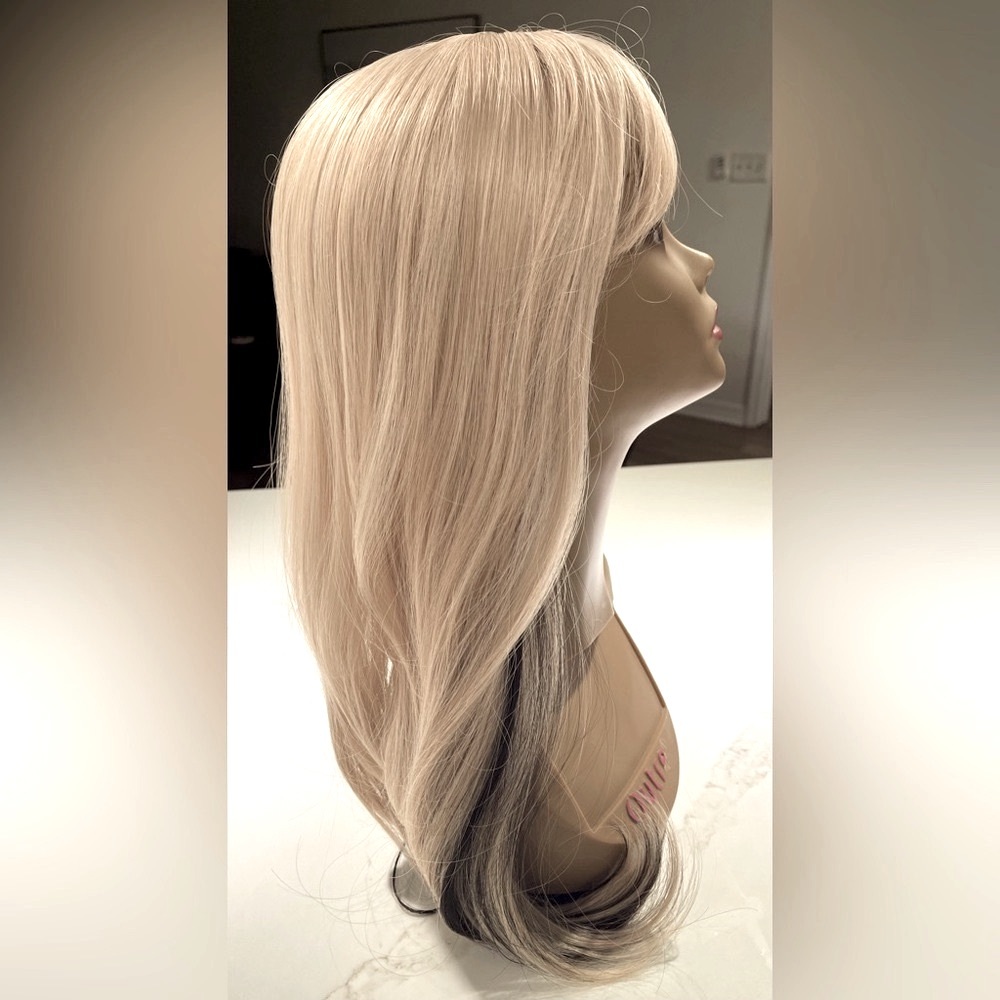 HAIR, 25” straight, layers, swoop bangs, blonde with black underneath.